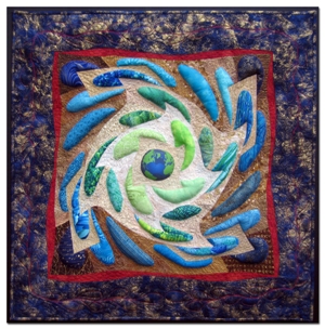 I am participating in a challenge with quilters from the west coast and the UK. This is a traveling exhibit called "Go Green". I imagined what the earth might look like if it was going green and spewing excess green color into the universe.